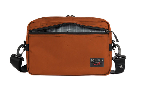 The Side Hustle in Burnt Orange Ballistic with Northwest Sky (grey) 200 Halcyon interior.